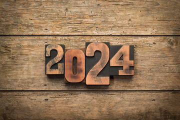 Year 2024 written with wooden letterpress printing blocks