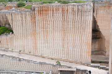 Fototapeta na wymiar ladder to the bottom of a deep impressive sandstone quarry