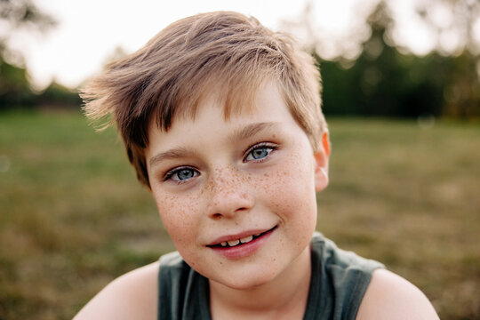 Portrait of smiling boy with gray eyes