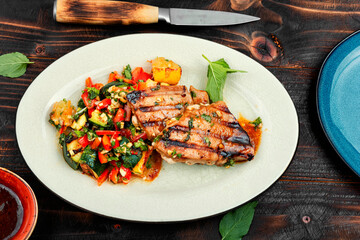 Plate of tuna grilled steak with salad