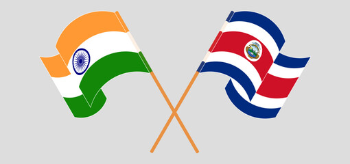 Crossed and waving flags of India and Costa Rica