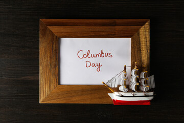 Columbus Day. Wooden frame with the inscription 