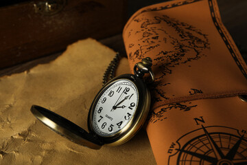 Columbus Day. Vintage pocket watch with an old sheet of paper