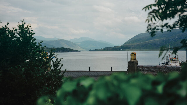 view of town, lake and mountains