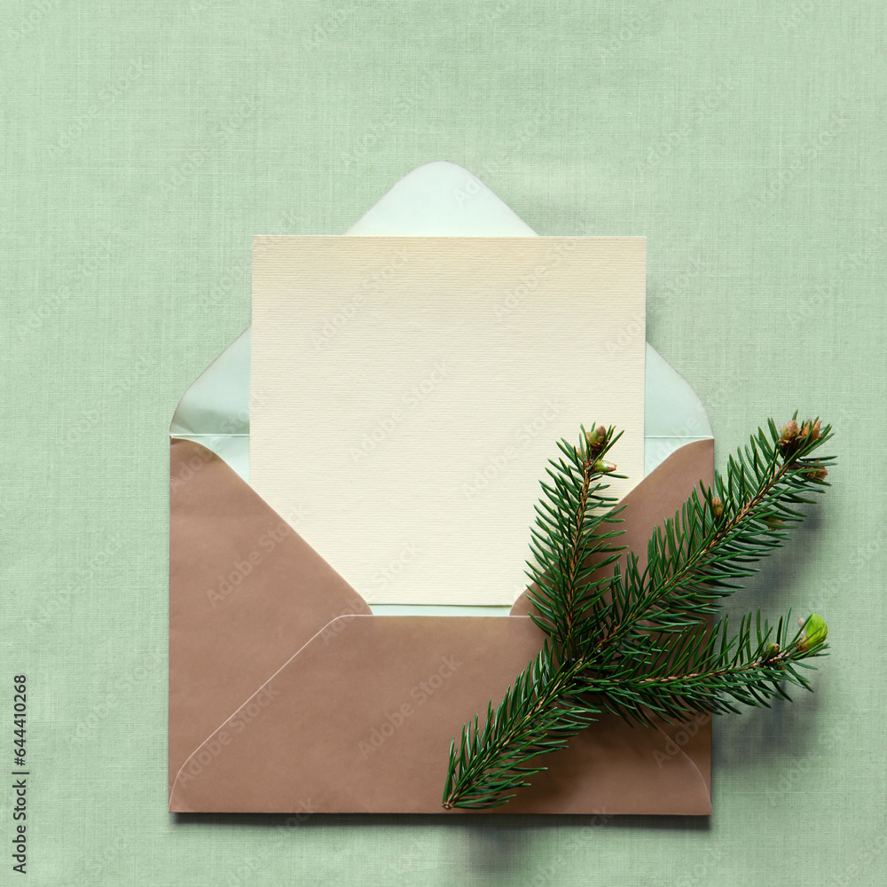 Canvas Prints Christmas still festive life. Blank greeting card, invitation mockup, envelope . Fir branches on a light textile background. Copy space, top view.