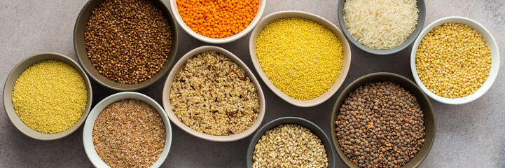Various grain cereals in bowls banner, top view