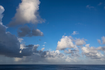 Naklejka na ściany i meble The picturesque Caribbean sky over the sea