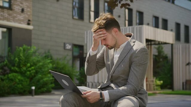 Businessman in Trouble, Man Reading Bad News on Laptop