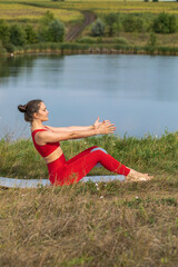 Happy young athletic woman doing gymnastics