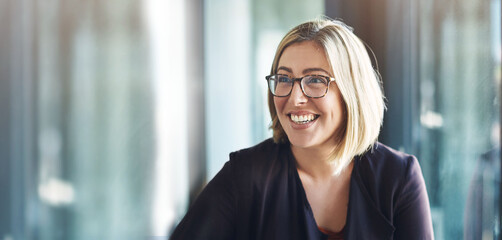 Face, smile and mockup with a designer woman in a creative, professional or modern workplace. Vision, thinking and space with a happy young design employee in her office boardroom for planning