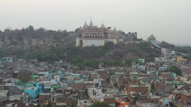 Aerial view of people celebrating the holy colour festival in the street in Barsana, Uttar Pradesh, India.