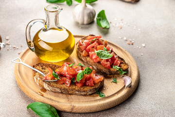 Italian bruschetta with tomatoes, basil, garlic and olive oil. antipasti snacks, Concept healthy and balanced eating. place for text, top view