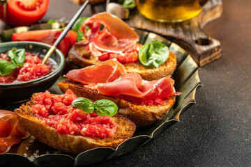 toasted bread with jamon cured ham and tomatoes for breakfast. Restaurant menu, dieting, cookbook recipe top view