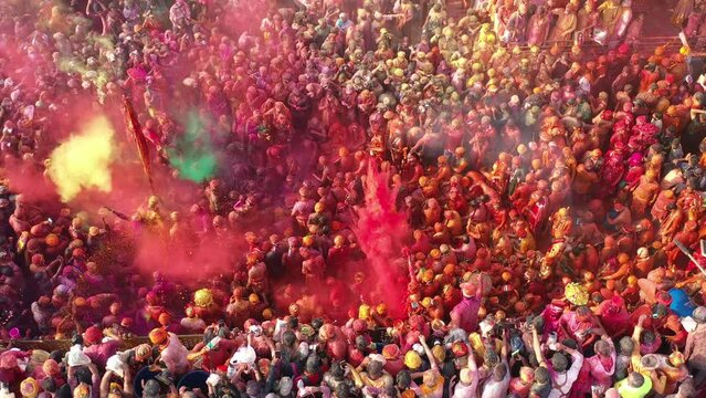 Barsana, India - 28 February 2023: Aerial view of people celebrating the holy colour festival in the street in Barsana, Uttar Pradesh, India.