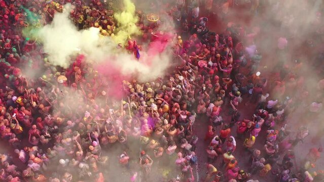 Barsana, India - 28 February 2023: Aerial view of people celebrating the holy colour festival in the street in Barsana, Uttar Pradesh, India.
