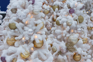 festive Christmas tree decorated with bright toys. New Year's Holiday