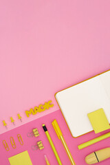 Card with yellow school and office stationery set on pink background.