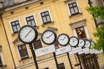 Fototapeta na wymiar Clocks showing the current time in cities around the world. Krakow, Poland
