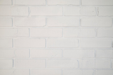 Brick white wall close-up. Grunge-style background.