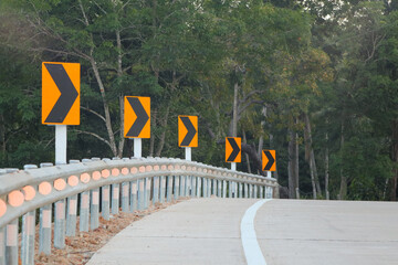 The sharp bend signs are included black and yellow on the road up to the hill in Thailand , to be careful drive 