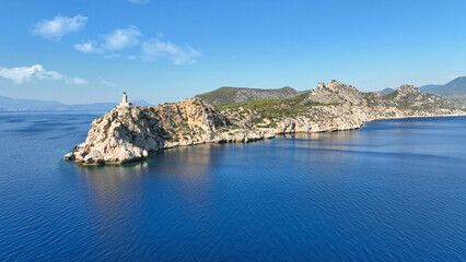 Obraz premium Aerial drone photo of beautiful and picturesque cape Melagavi forming a small peninsula with unique lighthouse stand out next to archaeological site of Heraion, Loutraki, Greece