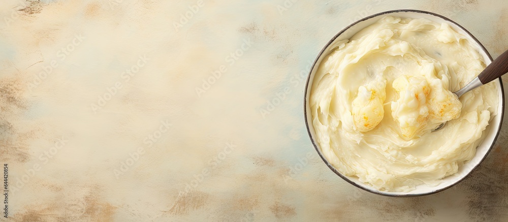 Poster potatoes mashed in large pot with spoon isolated pastel background copy space