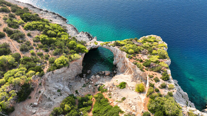 Aerial drone photo of secluded paradise emerald cave and beach called cave of the seals in Perachora, Corinthia, Greece