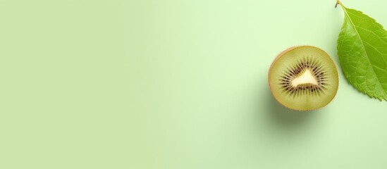 Small kiwi fruit actinidia arguta against isolated pastel background Copy space