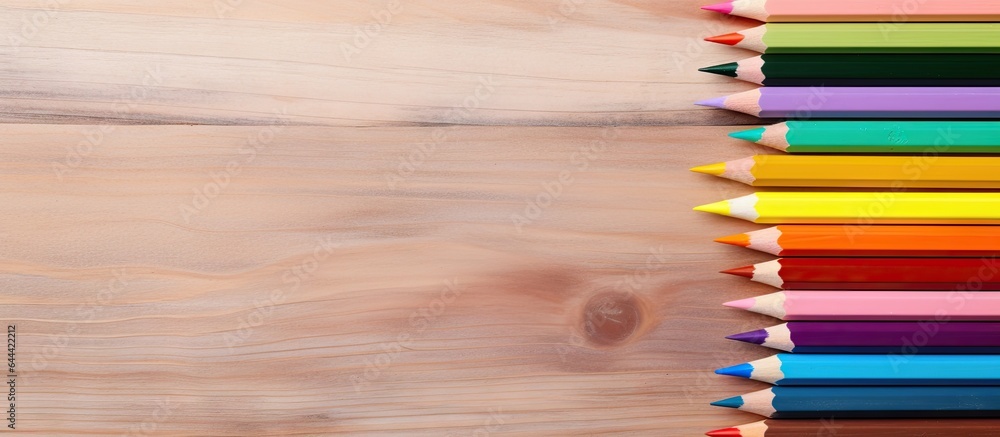 Aufkleber Selective focus on multi colored pencils and particle on a isolated pastel background Copy space