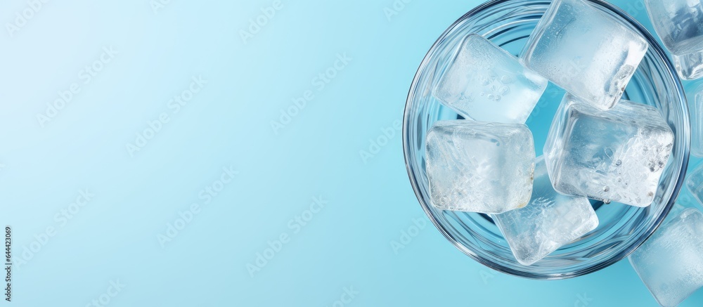 Canvas Prints Pure water in glass with ice on a isolated pastel background Copy space