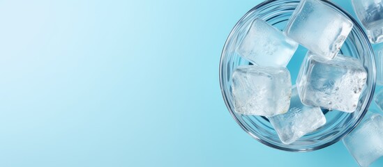 Pure water in glass with ice on a isolated pastel background Copy space