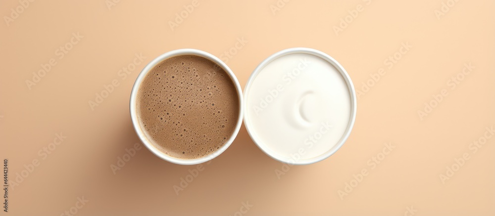 Poster yinyang or dao shaped coffee foam on top of a paper cup isolated pastel background copy space