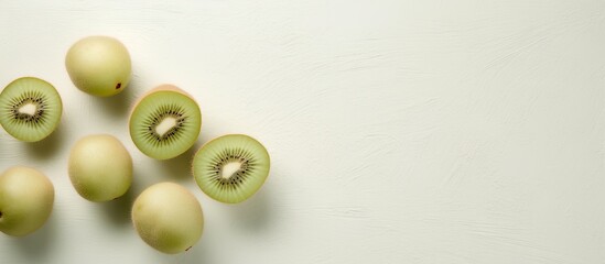 Small kiwi fruit actinidia arguta against isolated pastel background Copy space
