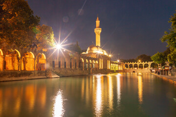 Sanliurfa, Turkey - June 19, 2023 : Balıklıgöl (Balık Lake) and Rizvaniye Mosque Landscape in...