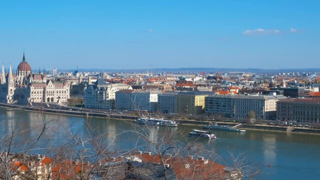 Buildings by secheni bridge. A view of places of interest on Danube river bank in the sun light. A concept of tourists places and Secheni bridge in Budapest.