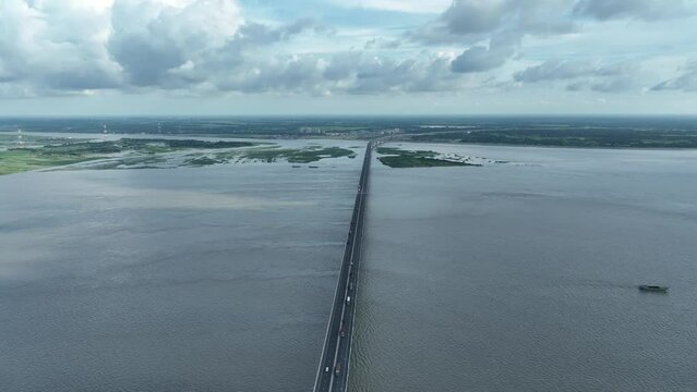 Aerial view of The Padma Multipurpose Bridge, the largest bridge, over the Padma river by day in perspective, Mawa, Munshiganj, Bangladesh.