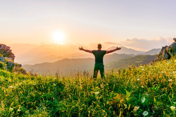 man doing hiking sport in mountains with anazing highland view