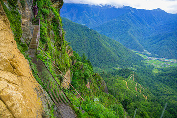 A walking rail attached on the side of a cliff for pilgrimage  