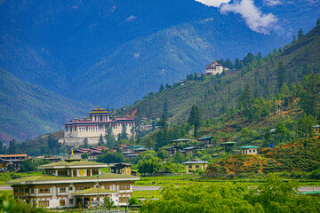 Paro Rinpung Dzong and Ta Dzong with Paro International Airport in the foreground