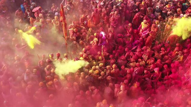Barsana, India - 28 February 2023: Aerial view of people celebrating the holy colour festival in the street in Barsana, Uttar Pradesh, India.