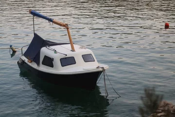 Papier Peint photo autocollant Navire Small rustic boat on the promenade. Picturesque scene from Croatia.