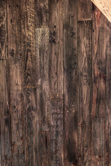 Dark rustic wooden background with a corner in different wood.
