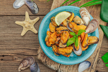 Mussels with oil, spices and greens. Healthy seafood is rich in omega. Marine decor