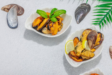 Mussels with oil, spices and greens. Healthy seafood is rich in omega. Marine decor