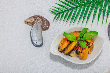 Mussels with oil, spices and greens. Healthy seafood is rich in omega. Marine decor