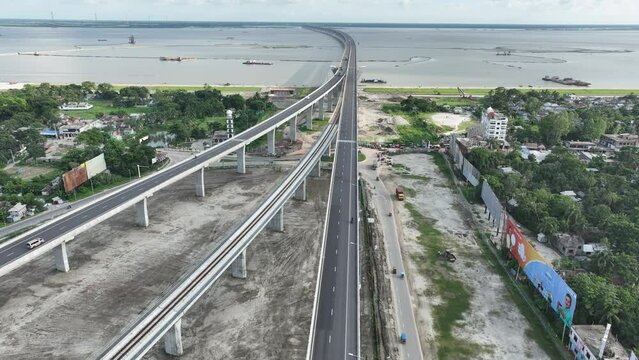 Aerial view of The Padma Multipurpose Bridge, the largest bridge, over the Padma river by day in perspective, Mawa, Munshiganj, Bangladesh.