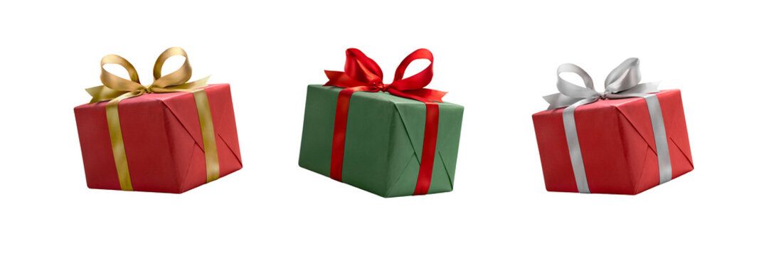 A collection of red and green gift wrapped presents with a red , gold and silver ribbon bows isolated against a transparent background.