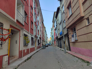 apartments lined up next to each other, the atmosphere of a small alley in Turkey is quiet in the afternoon