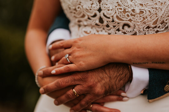 bride and groom holding hands