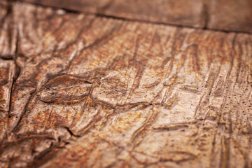 Extreme closeup of crumpled brass foil texture
